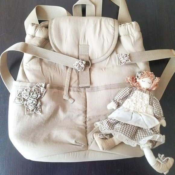 CORTILE Tan Girls Woman Drawstring Top Backpack with Doll and Flower Accent - Picture 1 of 12
